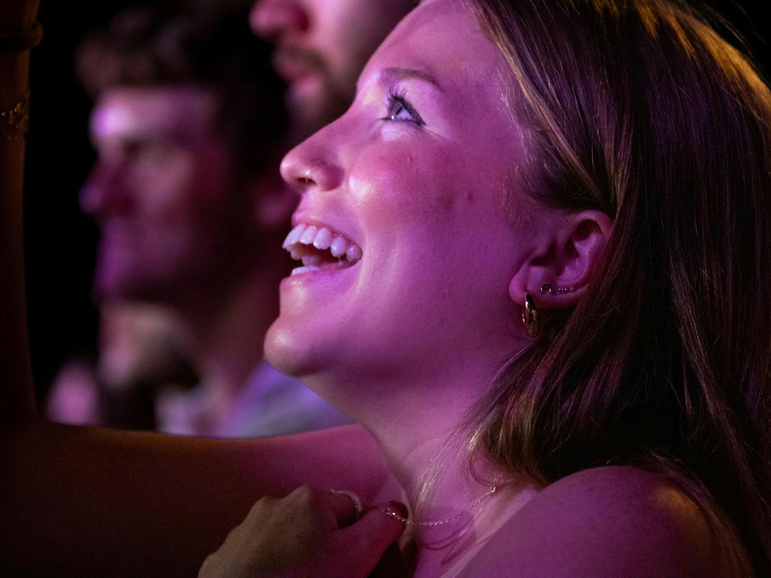 Third-year marketing student Jillian Coffman smiles during COIN's performance at Cockstock. Coffman said she attended Cockstock with several of her friends to experience COIN live.