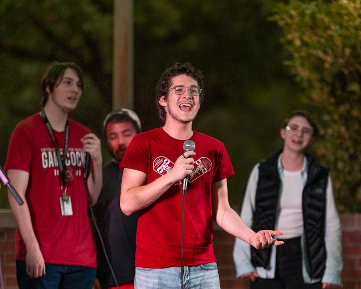 Second-year computer science student Wyatt Carhart sings during The Resonance's set at the Battle of the Bands on Oct. 5, 2022. The competition brought acappella, folk, rap, and rock music to the Russell House Patio in a variety of performances.