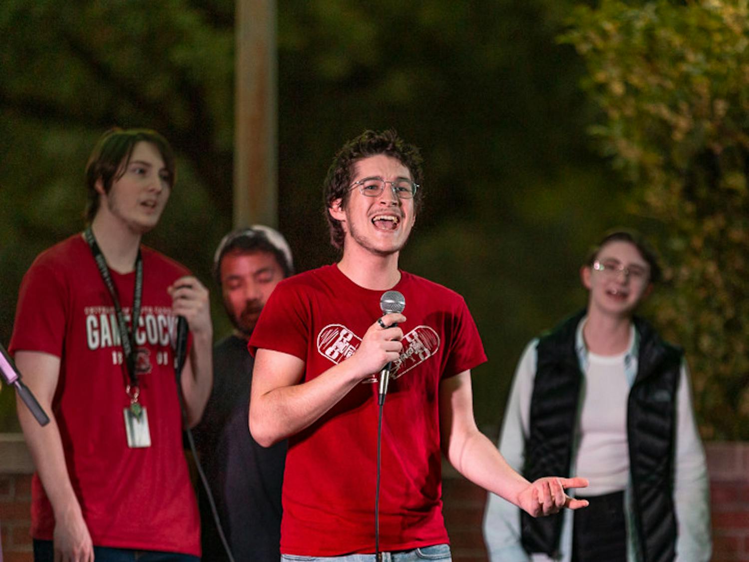 Second-year computer science student Wyatt Carhart sings during The Resonance's set at the Battle of the Bands on Oct. 5, 2022. The competition brought acappella, folk, rap, and rock music to the Russell House Patio in a variety of performances.