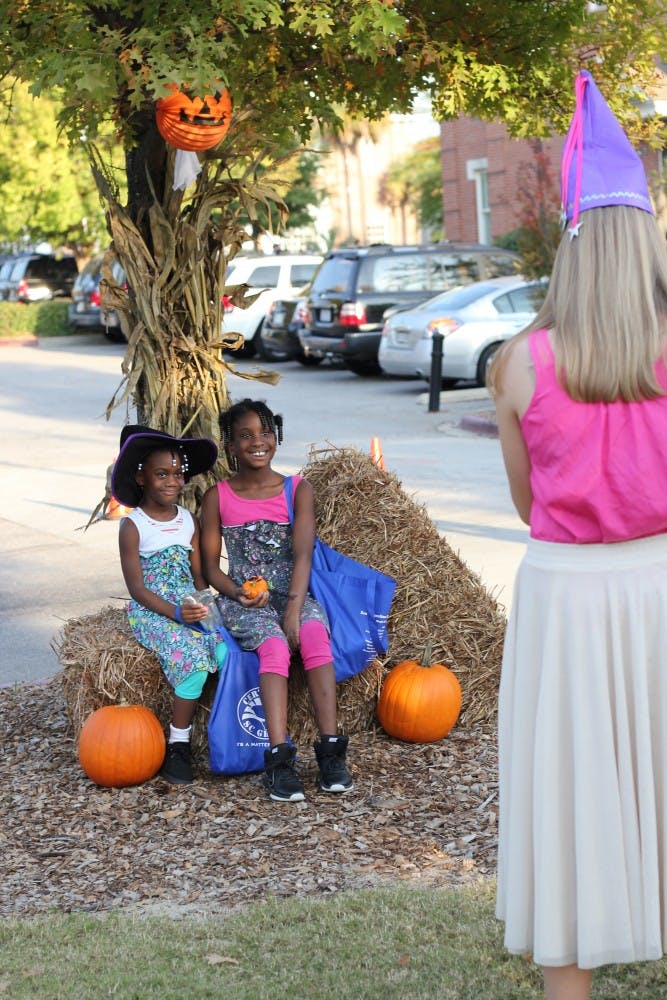 Children of USC faculty and staff as well as the surrounding neighborhood participating in Trick-or-Treat with the Greeks, an annual event where students from Greek organization give out candy and play games with the children.