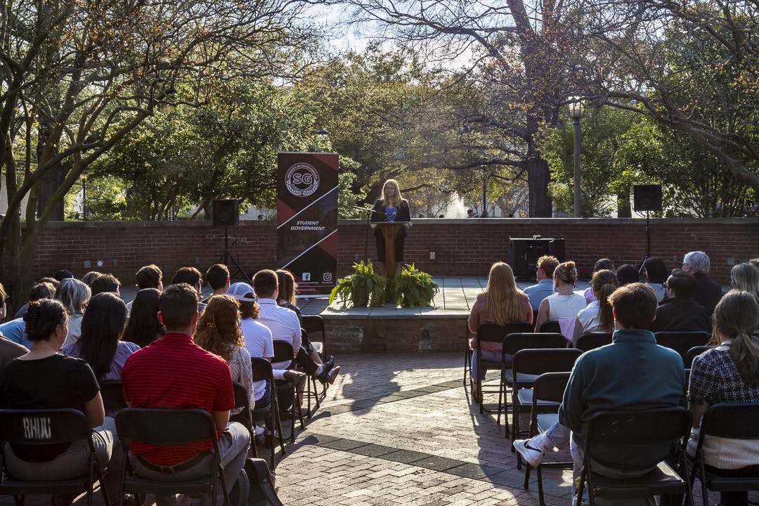 Student body president Reedy Newton gives her State of the Student Body address in front of an audience of students, faculty and staff on the Russell House patio on March 16, 2023. The address hasn't been given in person in at least six years.