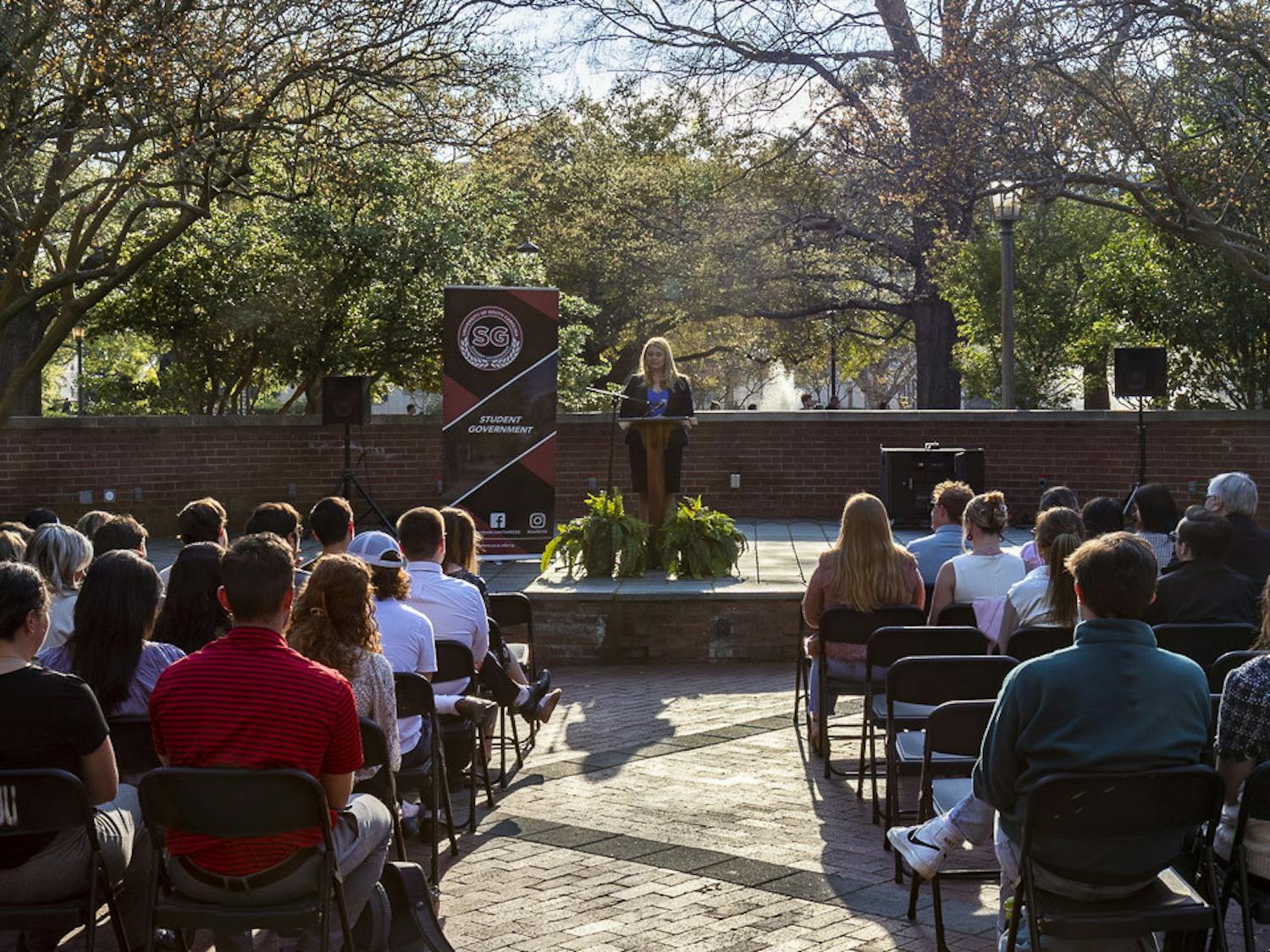 Student body president Reedy Newton gives her State of the Student Body address in front of an audience of students, faculty and staff on the Russell House patio on March 16, 2023. The address hasn't been given in person in at least six years.