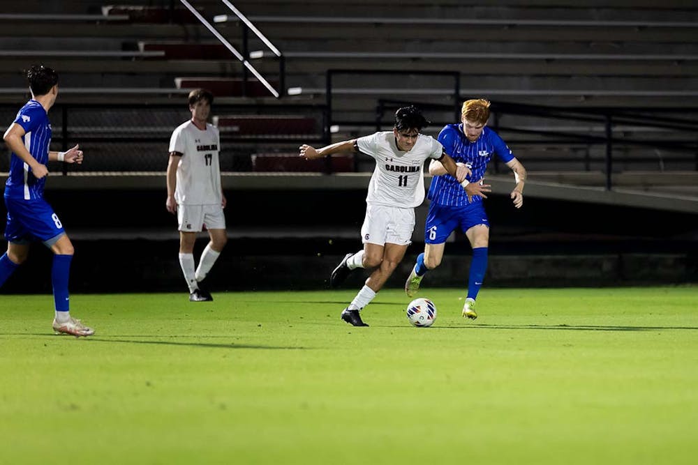 Freshman midfielder Rocky Perez keeps the ball in his possession while fighting off a Kentucky Wildcat opponent at Stone Stadium on Nov. 1, 2022. Perez has been apart of the starting lineup all season.