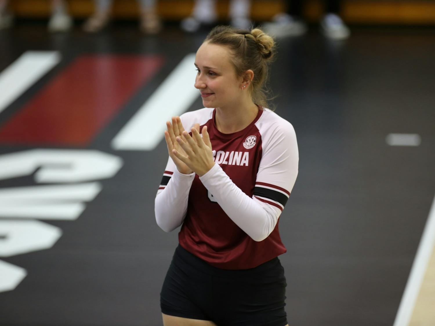 Setter Dalaney Hans clapping at the start of the Gamecocks' second game against the Tigers on Oct. 2, 2022. After a comeback first game, South Carolina closed its second game with a straight-set win.&nbsp;