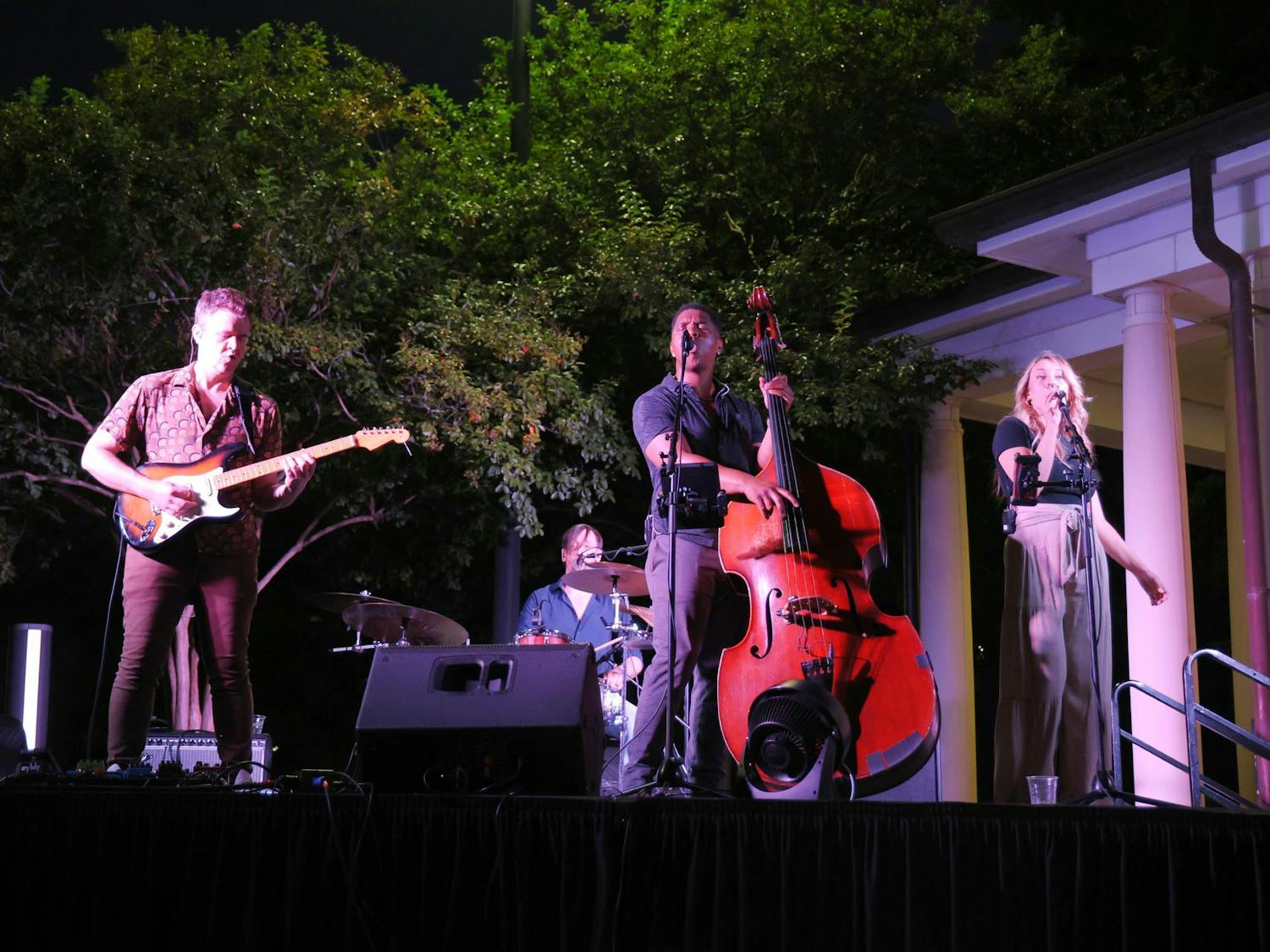 A band performs on stage next to the Strom Thurmond Wellness and Fitness Center pool during the ‘Rock the Roost’ event on Sept. 20, 2024. USC families enjoyed live music, food, drink, lawn games and an appearance from USC’s mascot, Cocky.