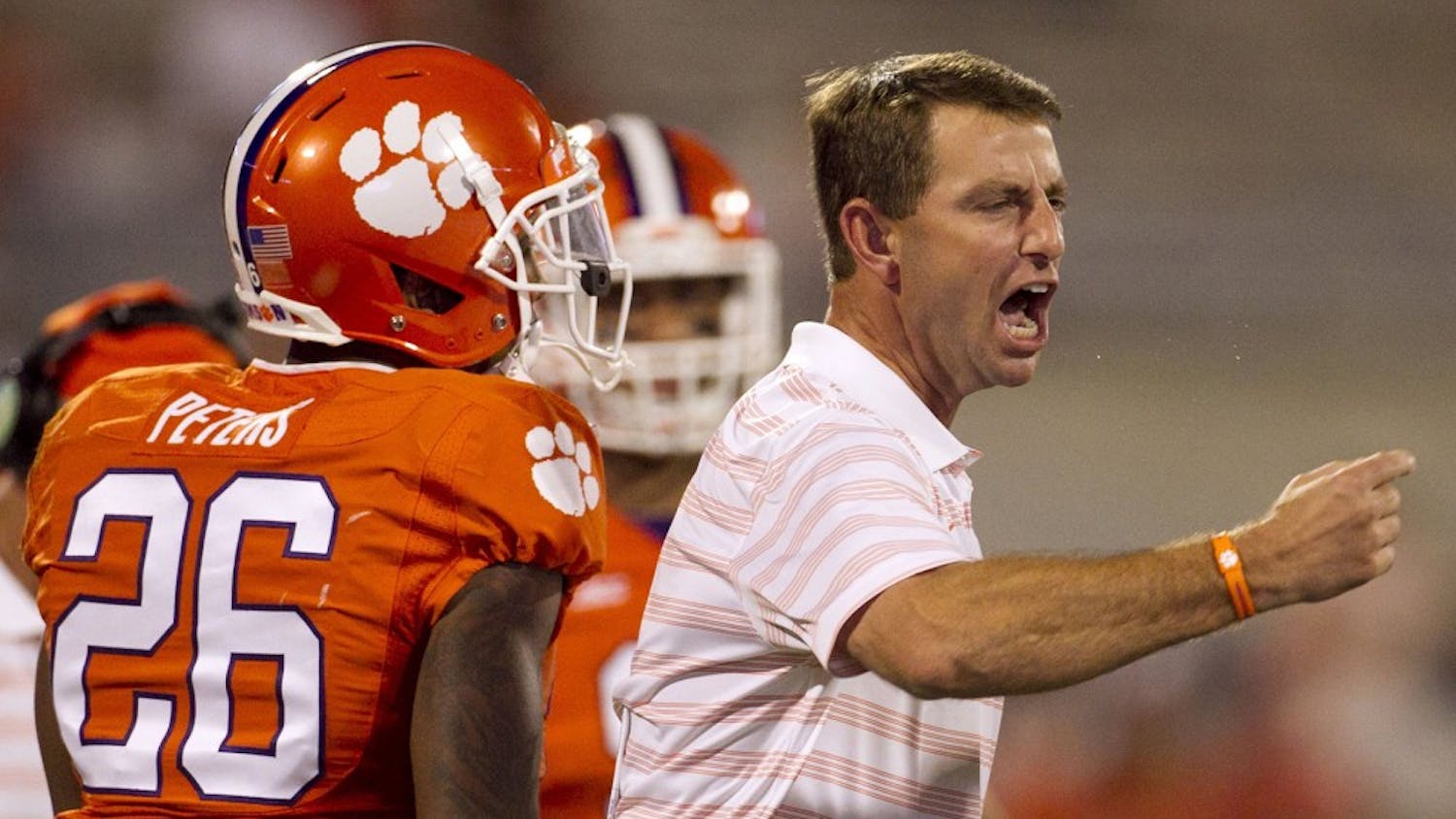 Clemson head coach Dabo Swinney yells at his defensive unit during a timeout in the fourth quarter against North Carolina at Memorial Stadium in Clemson, S.C., on Saturday, Sept. 27, 2014. Clemson won, 50-35. (Robert Willett/Raleigh News &amp; Observer/MCT)