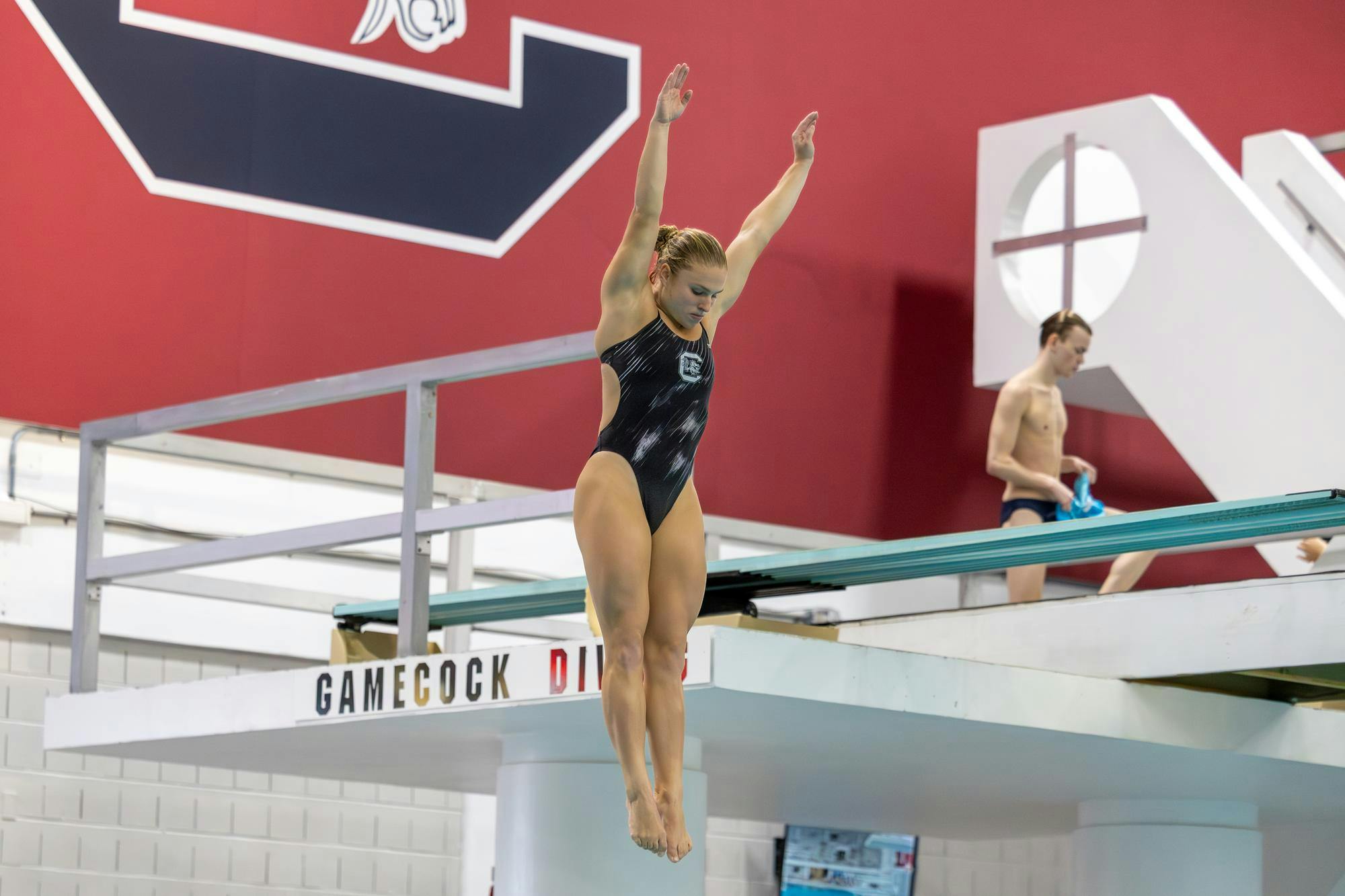 Senior diver Sophie Verzyl performs a dive during a meet against North Carolina on Nov. 7, 2025, at the Carolina Natatorium. Verzyl finished in first place for the women’s 1-meter diving event with a score of 342.75.