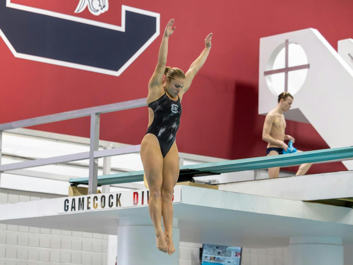 Senior diver Sophie Verzyl performs a dive during a meet against North Carolina on Nov. 7, 2025, at the Carolina Natatorium. Verzyl finished in first place for the women’s 1-meter diving event with a score of 342.75.