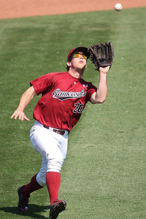 South Carolina Gamecocks left fielder Elliot Caldwell reels in a fly ball in the fourth inning against the Brown Bears in Columbia, S.C., on Sunday, March 9, 2014. (C. Michael Bergen/The State/MCT)