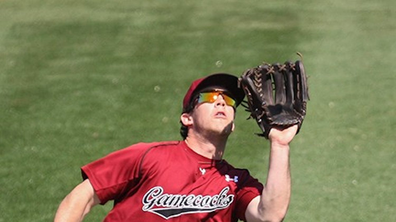 South Carolina Gamecocks left fielder Elliot Caldwell reels in a fly ball in the fourth inning against the Brown Bears in Columbia, S.C., on Sunday, March 9, 2014. (C. Michael Bergen/The State/MCT)