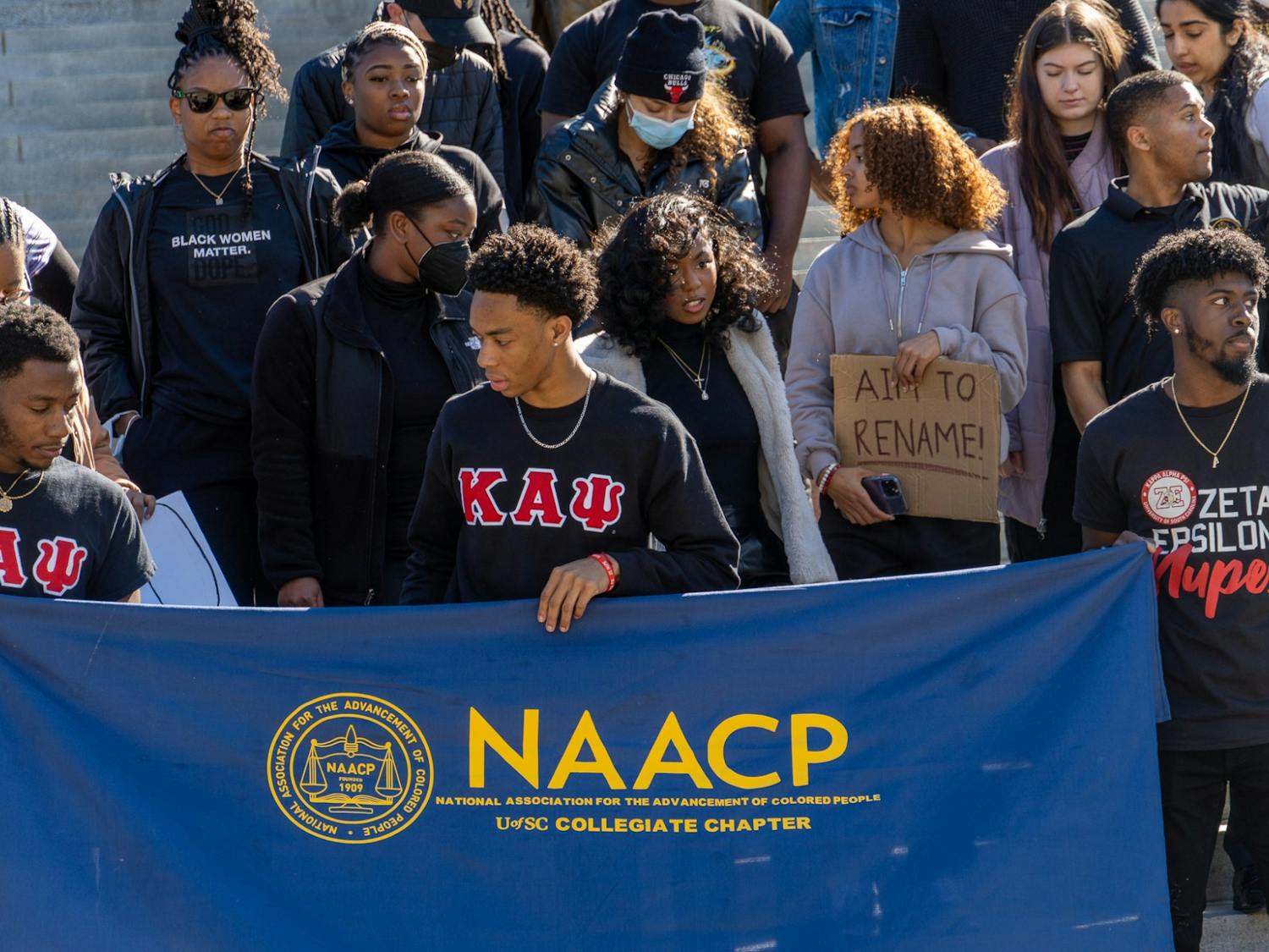 The protesters gather on the steps of the statehouse to complete their protest on Feb 5, 2022. The USC NAACP chapter sponsored this event calling for the repeal of the S.C. Heritage Act and the removal of segregation and civil war era SC figures from university building names and state sponsored structures.