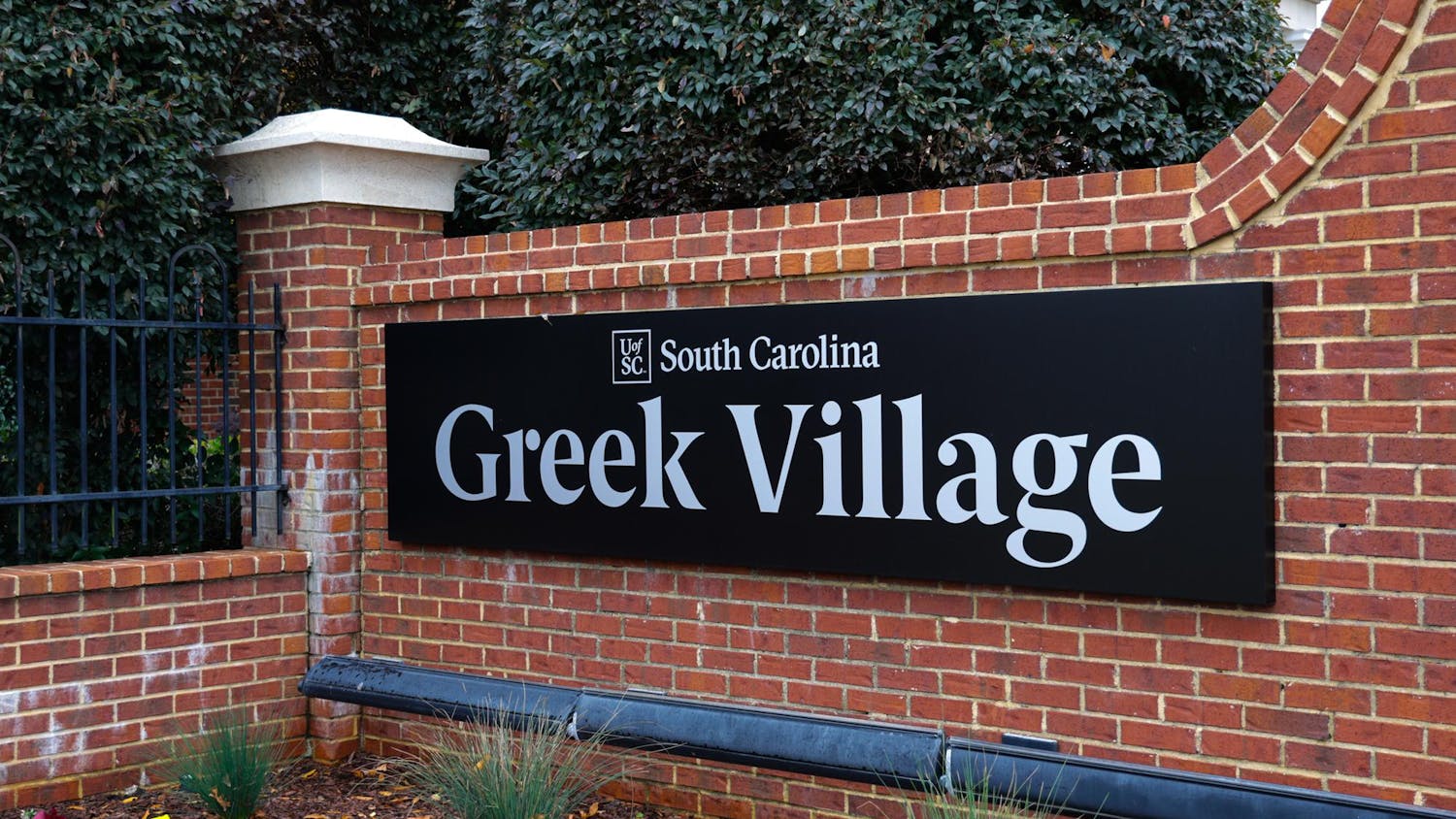 The Greek Village sign stands on Blossom Street on Dec. 2, 2023. Greek Village is currently home to 13 sororities and seven fraternities.