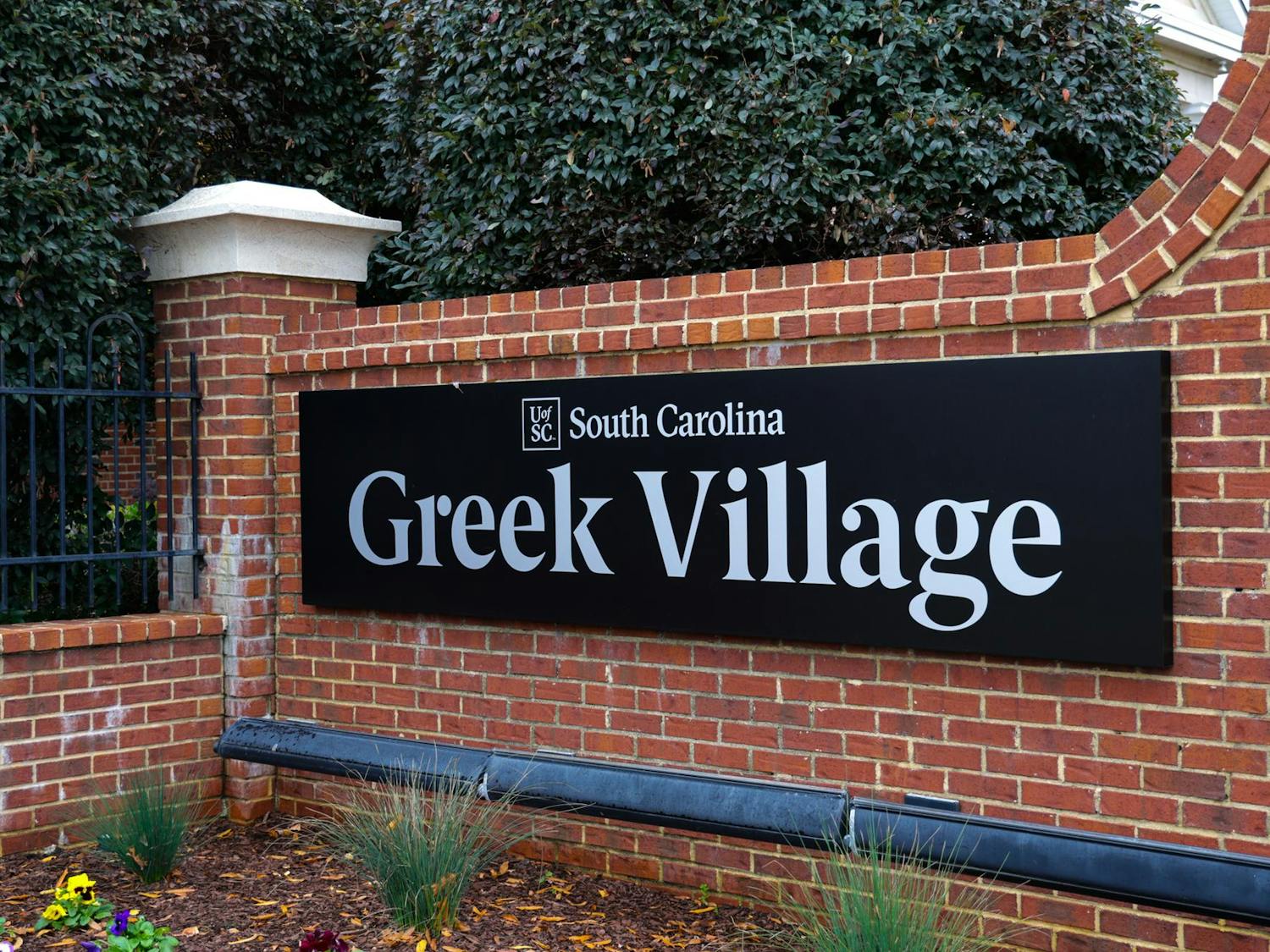 The Greek Village sign stands on Blossom Street on Dec. 2, 2023. Greek Village is currently home to 13 sororities and seven fraternities.