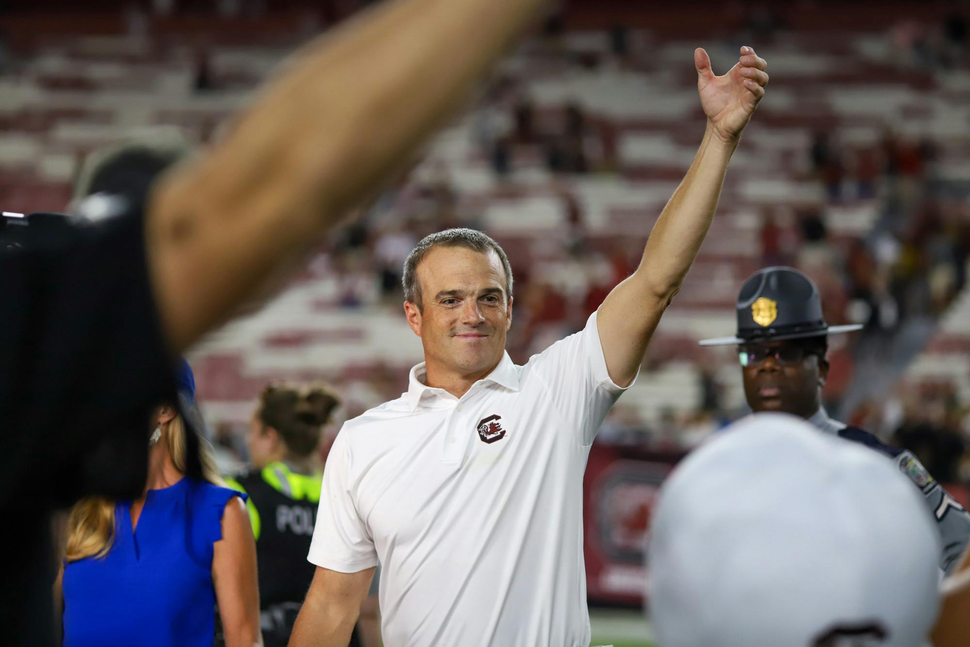 Head football coach Shane Beamer holds up his hand during the alma mater after South Carolina defeated Furman 47-21 in its first home game of the 2023 season. Beamer is now 16-12 in just over two seasons as the Gamecocks' coach.
