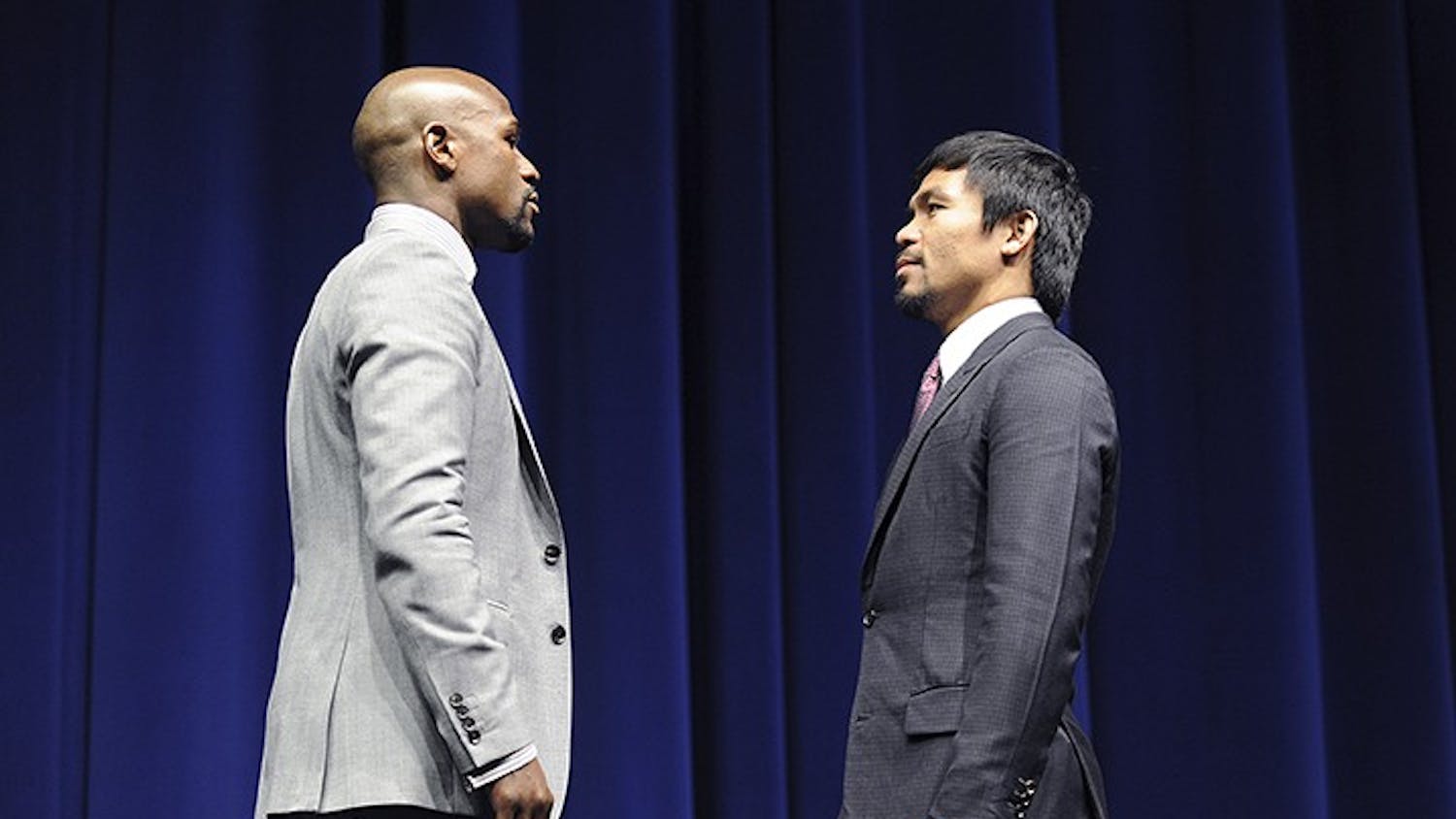 Floyd Mayweather, left, and Manny Pacquiao square off during a news conference at the Nokia Theatre in Los Angeles on Wednesday, March 11, 2015. The two welterweights will meet in the ring on May 2, 2015.(Wally Skalij/Los Angeles Times/TNS)