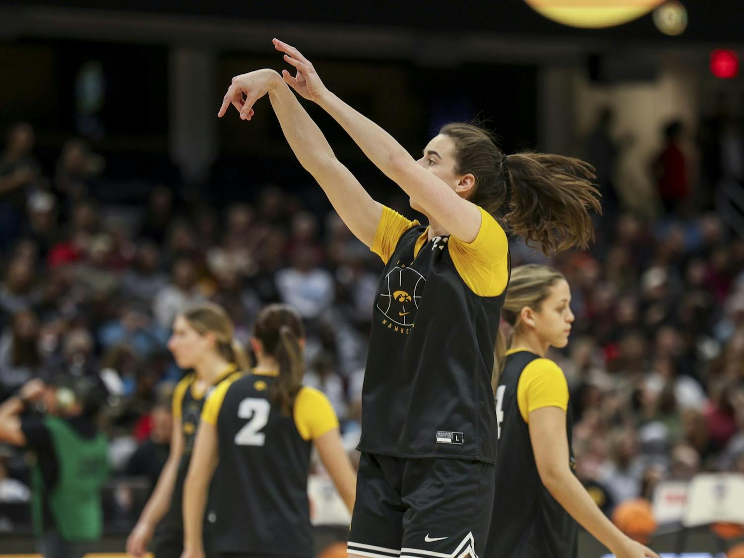 Hawkeye senior guard Caitlin Clark attempts a 3-point shot during Super Saturday open practice in Cleveland, Ohio. Clark scored 21 points for the Hawkeyes during their semifinal match-up against the University of Connecticut Huskies on April 5, 2024. The semifinal game marked the second time this season that Clark did not lead the Hawkeyes in scoring.