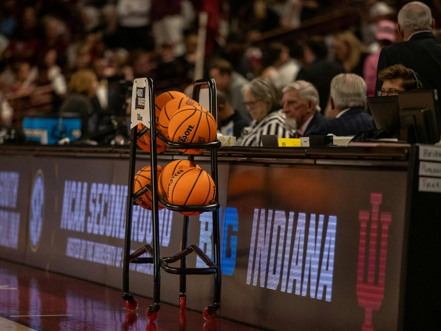 A cart of basketballs sits on the court as the University of South Carolina and Indiana University get set to play in the second round of the NCAA March Madness tournament on March 23, 2025. This is the second straight year these two teams have met in the tournament.
