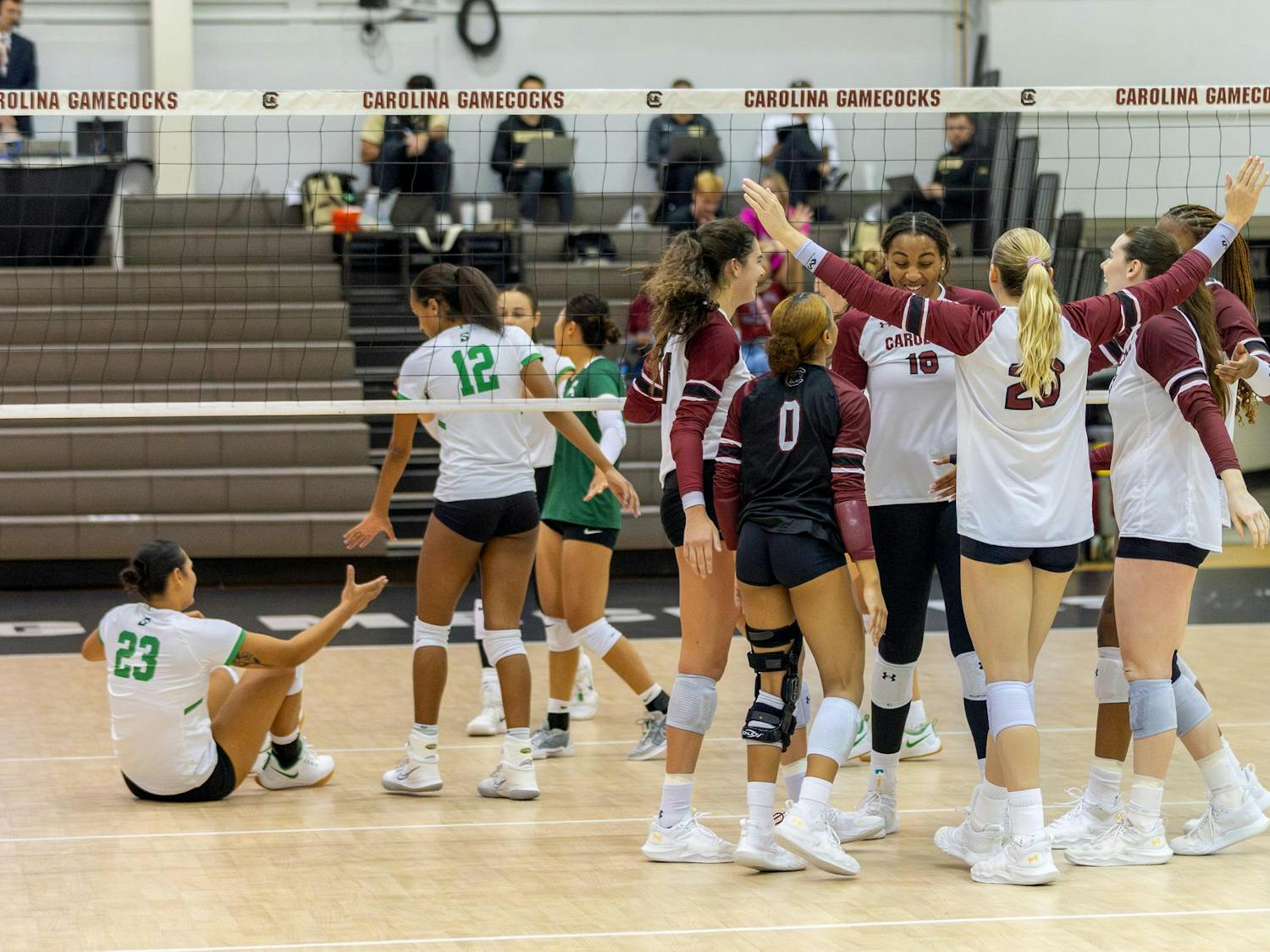 The Gamecocks celebrate a successful point while the Hatters regroup and help their teammates off the floor during the Gamecocks' matchup against the Hatters at the Carolina Volleyball Center on Sept. 13, 2024. South Carolina’s 3-1 victory over Stetson marked the team’s sixth match victory this season.