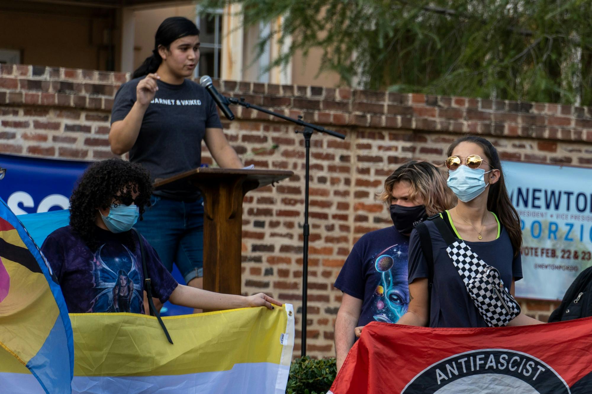 A group of protesters carry flags and give speeches on Greene St. during anti-hate speech protest on Feb. 24, 2022. The protest comes in response to recent comments from group Turning Point USA.&nbsp;