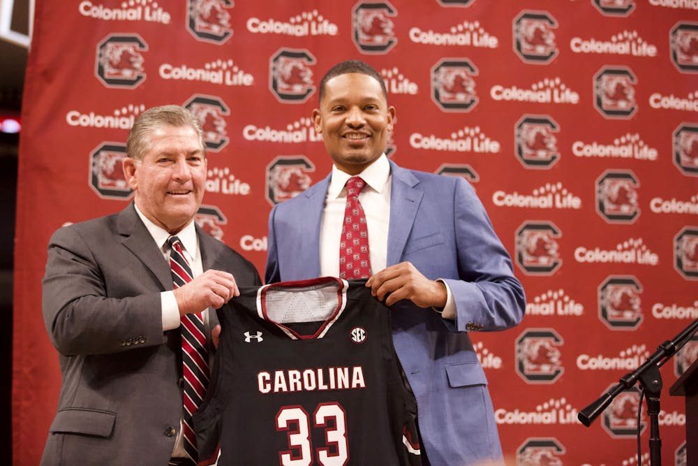 <p>New men’s basketball coach Lamont Paris and Athletic Director Ray Tanner during his introductory press conference on March 24, 2022. Paris is the 33rd head coach in program history.&nbsp;</p>