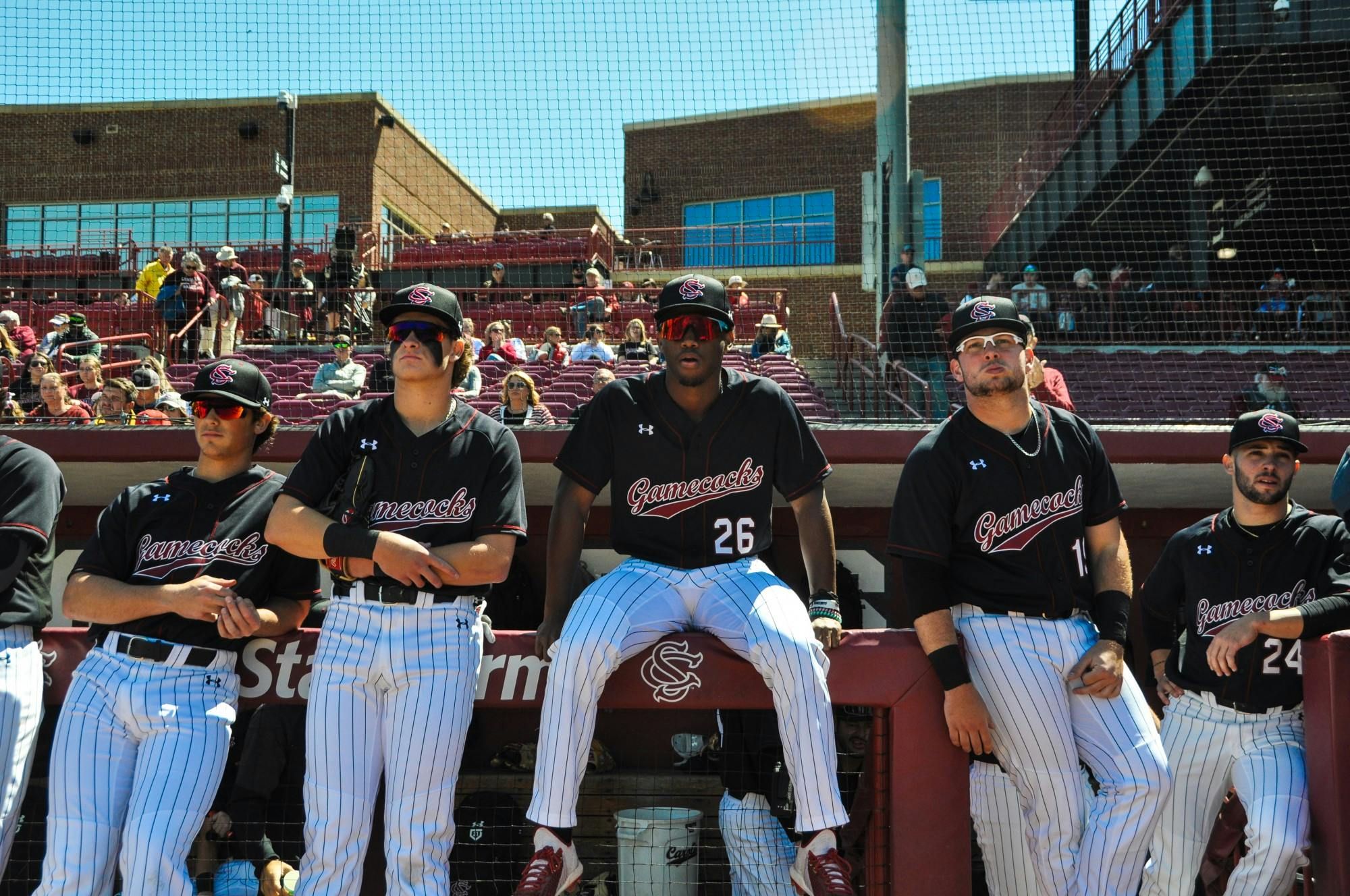 FILE—Freshman outfielder Thad Ector and players from the baseball team sit along dugout prior to their game against Vanderbilt.