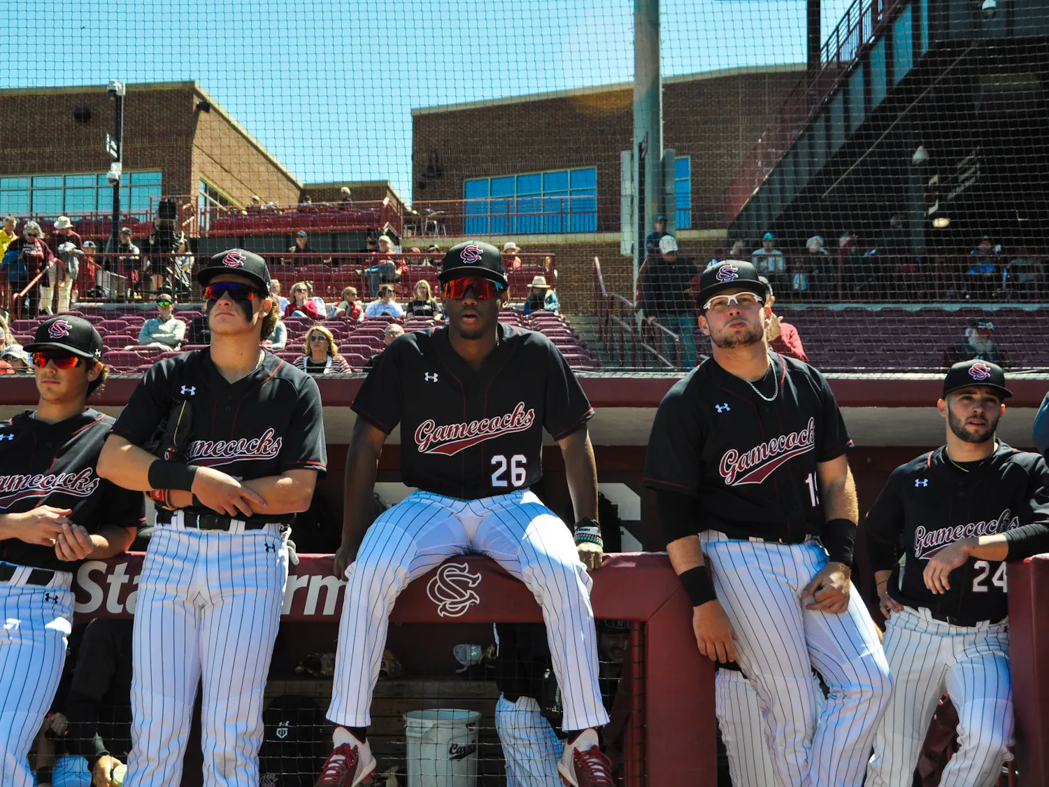 FILE—Freshman outfielder Thad Ector and players from the baseball team sit along dugout prior to their game against Vanderbilt.