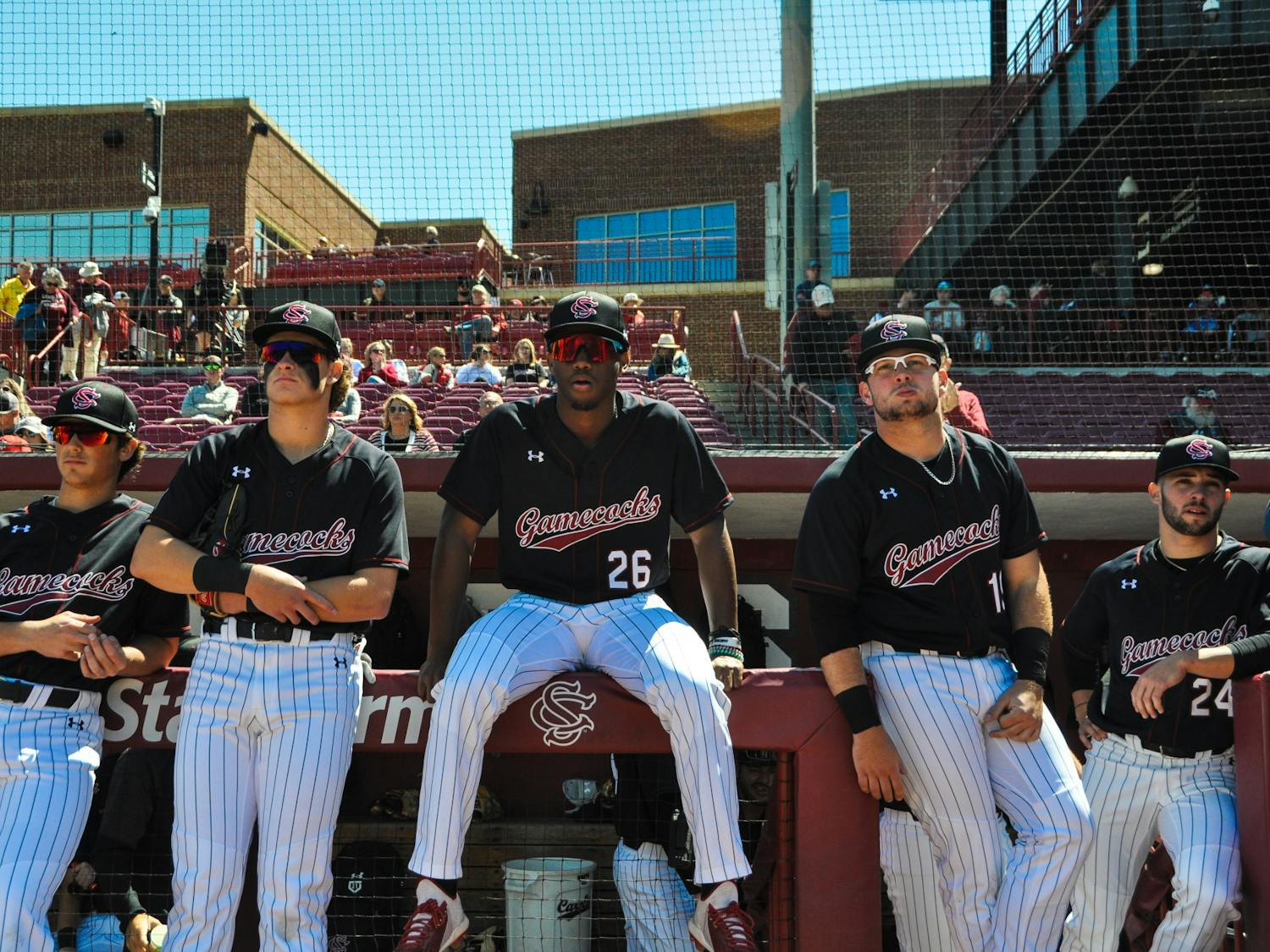FILE—Freshman outfielder Thad Ector and players from the baseball team sit along dugout prior to their game against Vanderbilt.