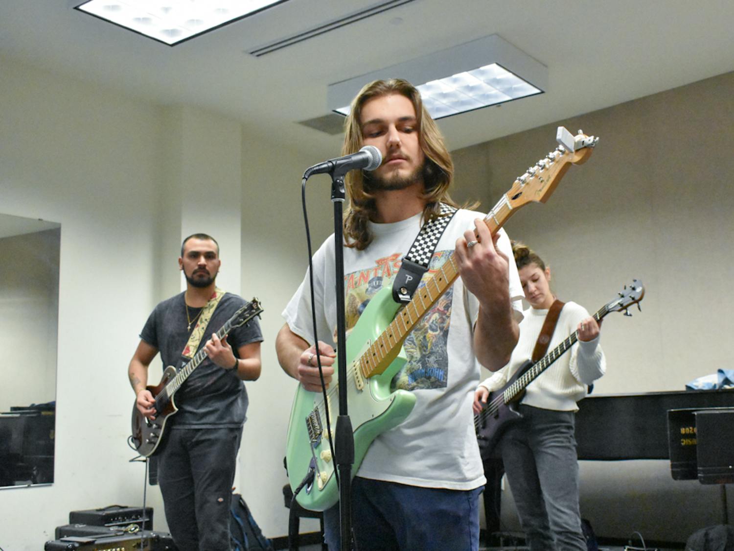 Third-year music industry studies student Stephen Bell, fourth-year music industry studies student Hope Wilberger and Milvid practice together as a part of USC’s School of Music’s commercial music ensemble class. Students in USC’s School of Music’s commercial music ensemble class said they have found comfort in performing and playing music as an outlet for creative therapy.