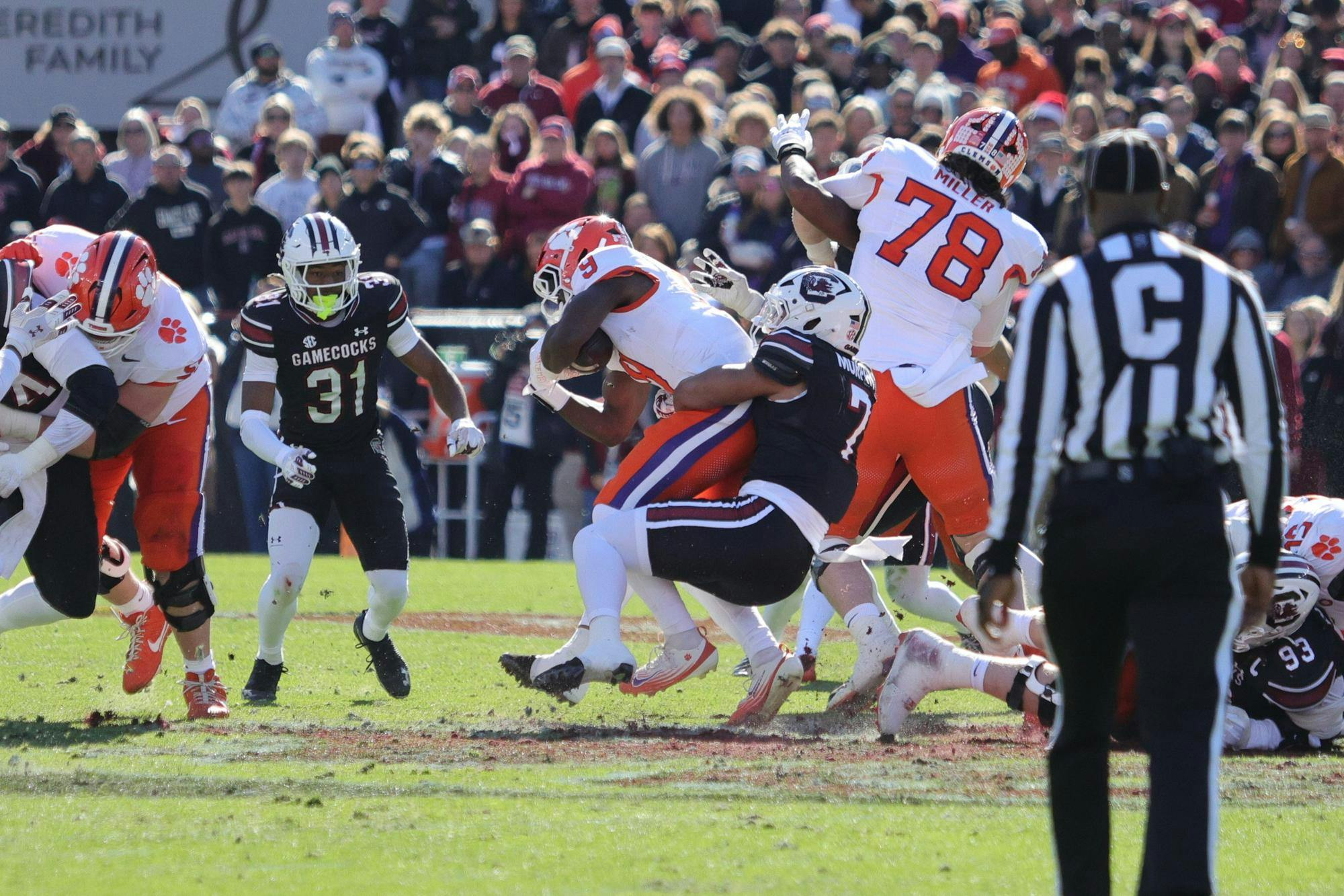 Redshirt junior linebacker Shawn Murphy pulls down a Clemson ball carrier during South Carolina’s game on Nov. 29, 2025, at Williams-Brice Stadium. Murphy steps in to stop the play as the Gamecocks’ defense closes in around the runner.