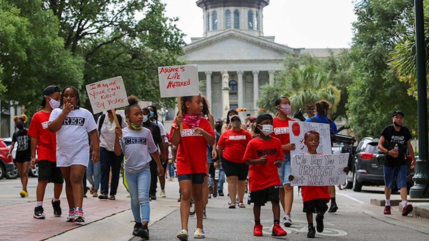 Children lead the Black Lives Matter march starting at the Statehouse. The march was primarily led by children to represent those lost to police brutality. One sign reads: "Imagine your child killed by police."