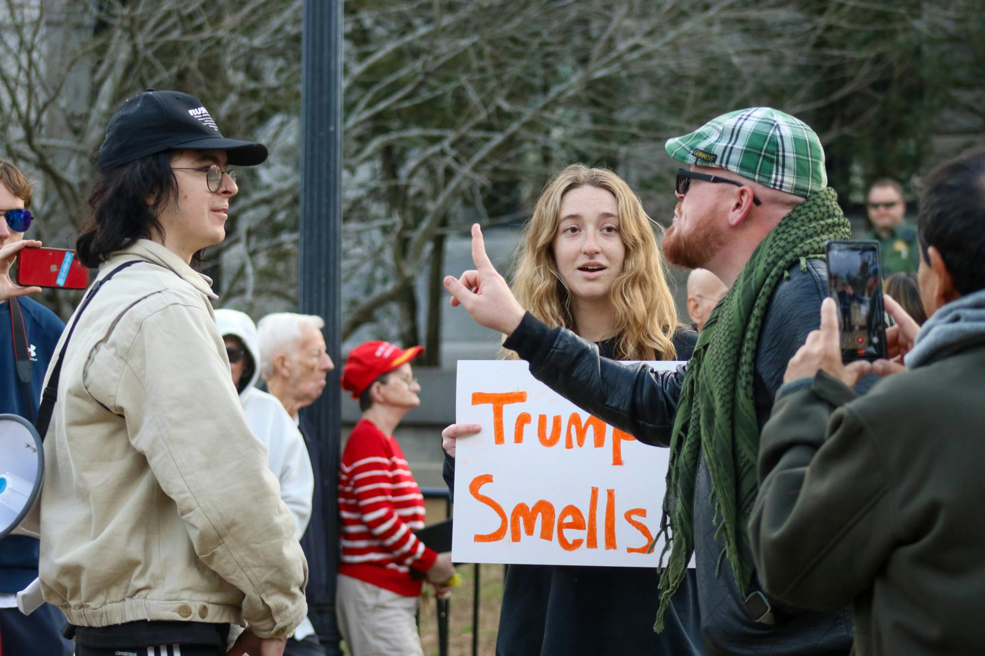 JT Bessinger (right) yells at counter protestors in one of the few conflicts on the Statehouse lawn on Jan. 28, 2023. "You have hijacked the gay community," he said as he continued to express his views to a very supportive, surrounding crowd. The protestors photographed the only to actively mix in the larger group of Trump supporters.&nbsp;