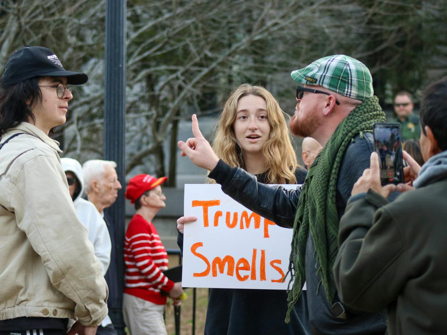 JT Bessinger (right) yells at counter protestors in one of the few conflicts on the Statehouse lawn on Jan. 28, 2023. "You have hijacked the gay community," he said as he continued to express his views to a very supportive, surrounding crowd. The protestors photographed the only to actively mix in the larger group of Trump supporters.&nbsp;