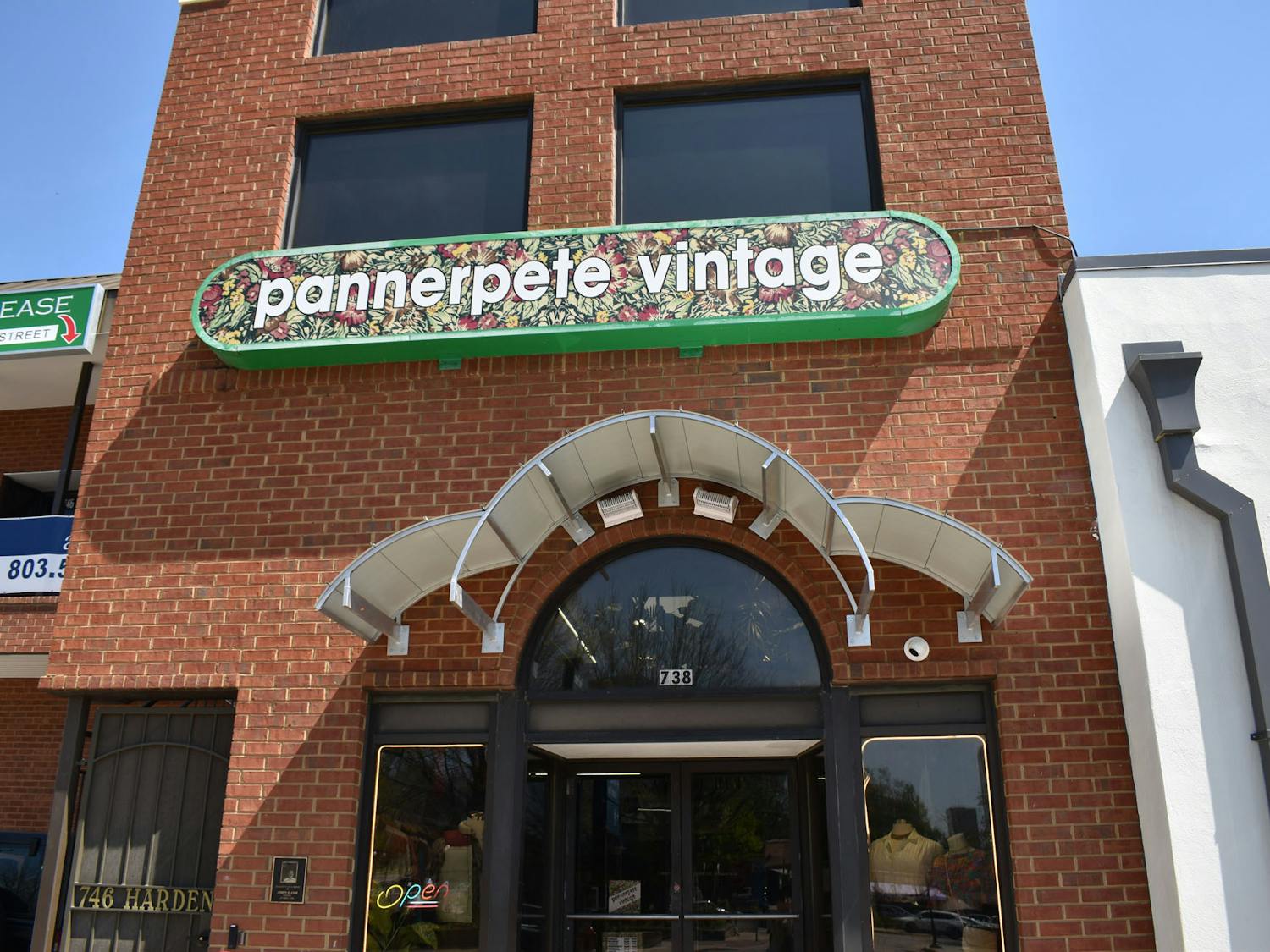 A photo of the outside of Pannerpete Vintage clothing store on Harden Street in Five Points on March 23, 2023. The store is open daily from 11 a.m. to 7 p.m., and features a variety of vintage clothing and jewelry.