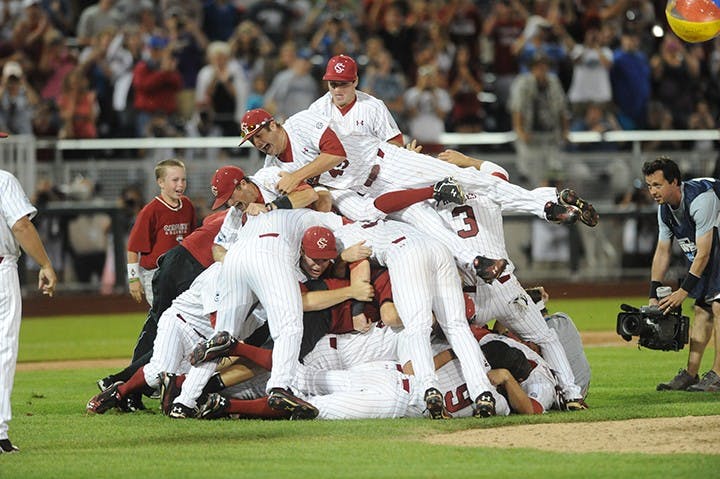The 2011 baseball team dogpiling the field after winning the college World Series.