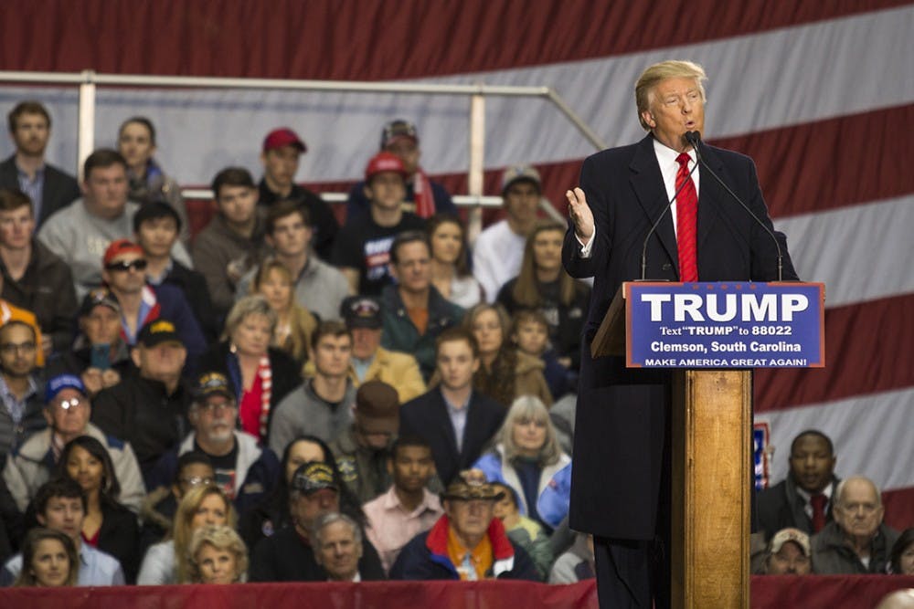 Presidential hopeful Donald J. Trump addresses economic concerns and answers audience questions at the T. Ed Garrison Arena in Clemson, South Carolina.