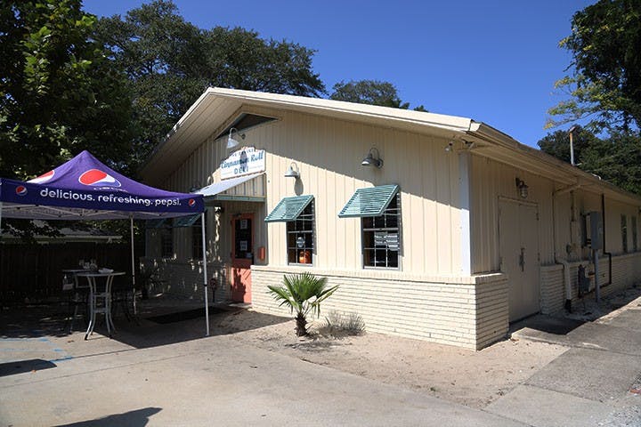 The storefront of Cinnamon Roll Deli is tucked away off Divine street.&nbsp;The Cinnamon Roll Deli is popular with students and the surrounding community.&nbsp;
