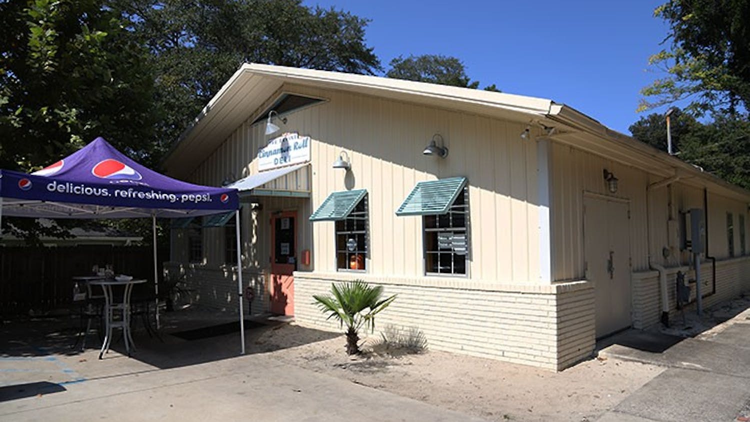 The storefront of Cinnamon Roll Deli is tucked away off Divine street.&nbsp;The Cinnamon Roll Deli is popular with students and the surrounding community.&nbsp;