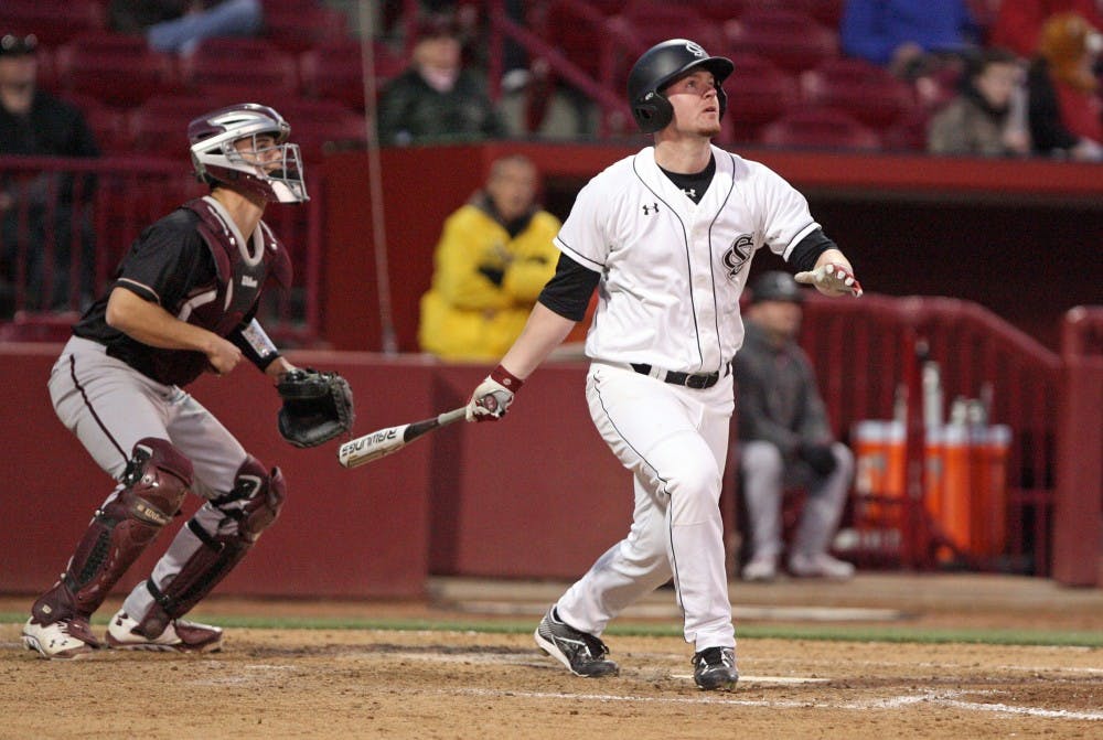 South Carolina's Alex Destino hits a go-ahead two-run home run in the sixth inning against College of Charleston at Carolina Stadium in Columbia, S.C., on Saturday, Feb. 14, 2015. The host Gamecocks defeated the Cougars, 8-3, in the completion of a game halted by weather on Friday. (Dwayne McLemore/The State/TNS)