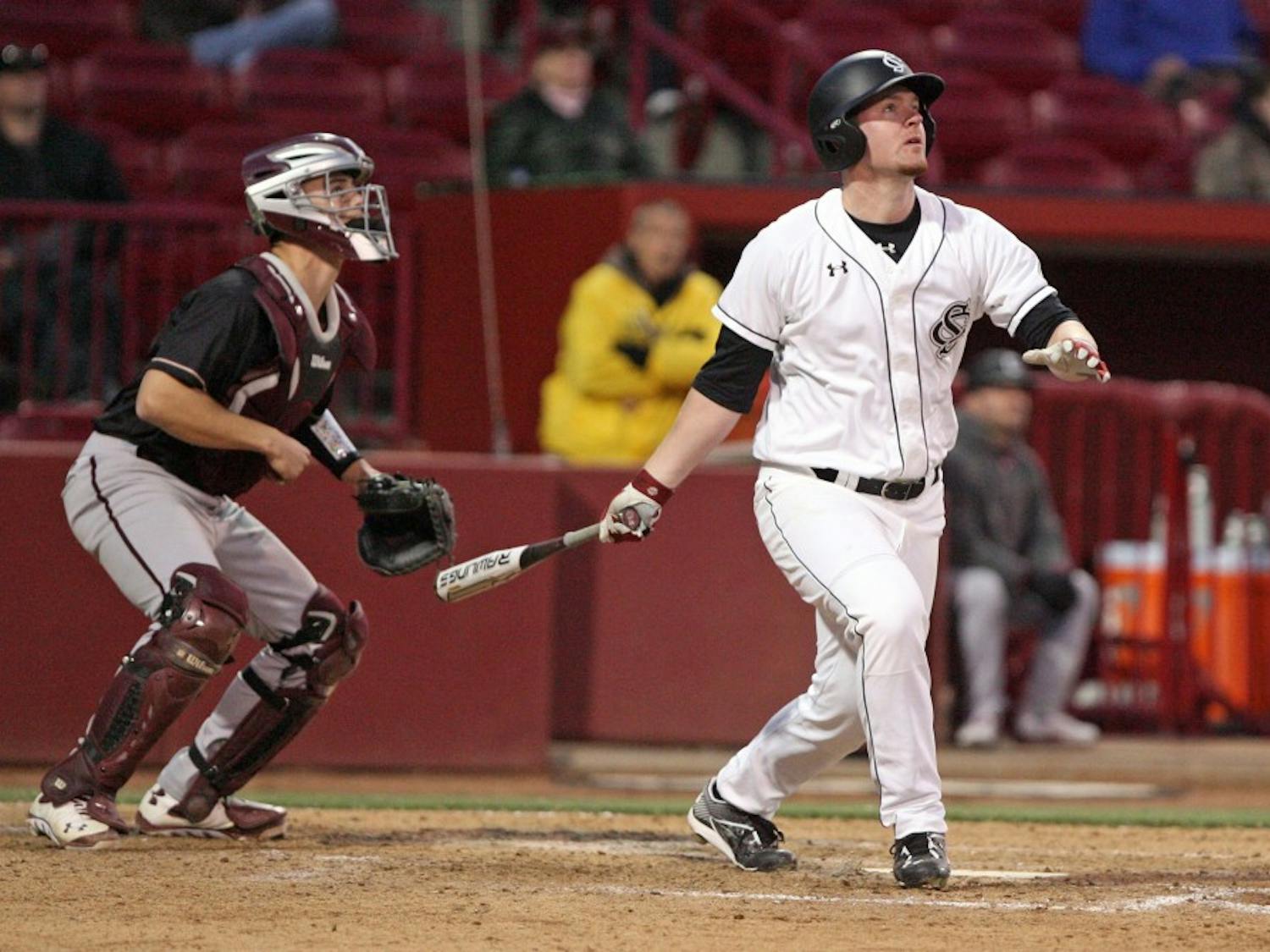 South Carolina's Alex Destino hits a go-ahead two-run home run in the sixth inning against College of Charleston at Carolina Stadium in Columbia, S.C., on Saturday, Feb. 14, 2015. The host Gamecocks defeated the Cougars, 8-3, in the completion of a game halted by weather on Friday. (Dwayne McLemore/The State/TNS)