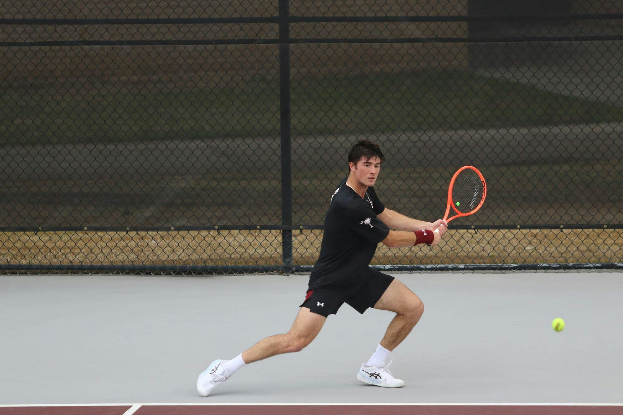 Sophomore Atakan Karahan winds up to return a hit in his singles match against Longhorn freshman Abel Forger Feb. 27, 2026. Karahan lost the match to Forger, 6-2, 6-2.