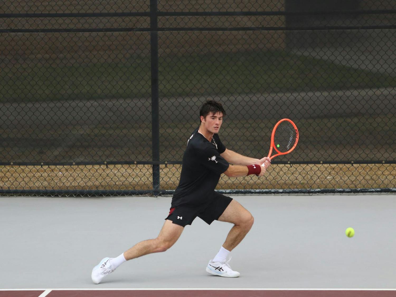 Sophomore Atakan Karahan winds up to return a hit in his singles match against Longhorn freshman Abel Forger Feb. 27, 2026. Karahan lost the match to Forger, 6-2, 6-2.