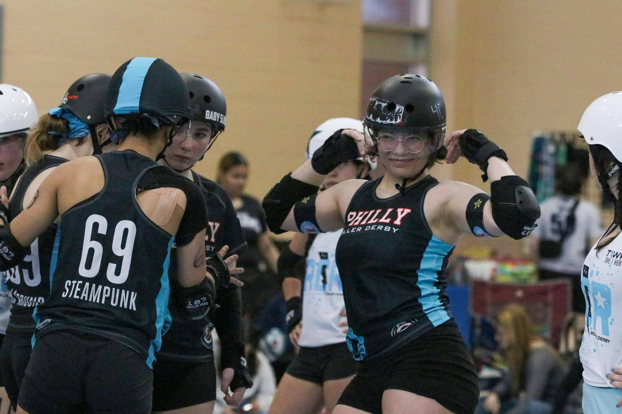 Philly All-Star skater Annaliese “Jack in the Box” Difuntorum flexes her arms before a jam at St. Andrews Park on March 21, 2026. A match consists of two 30-minute periods that consist of multiple jams, which are opportunities for teams to score points. “My friend got into (roller derby), and then they brought me to an open house,” Difuntorum said. “I realized, ‘Oh my God, this is something I could do for my entire life.’”