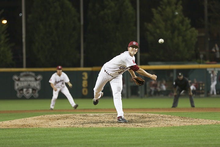 Freshman Cam Tringali pitches the ball during the Friday night game against Auburn at Founders Park.&nbsp;