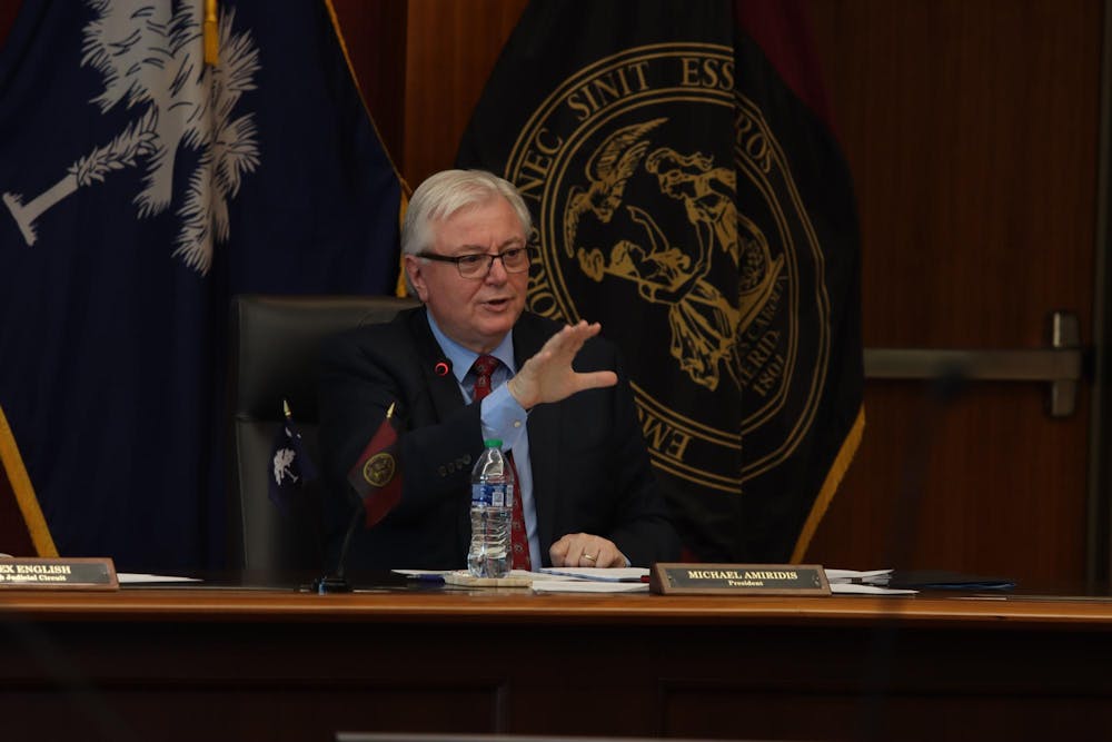 <p>FILE - University of South Carolina President Michael Amiridis speaks at a board of trustees meeting on Feb. 23, 2024 at the Pastides Alumni Center. The board of trustees approved new academic initiatives, renovation projects and employee contracts in its most recent meeting on Friday.</p>