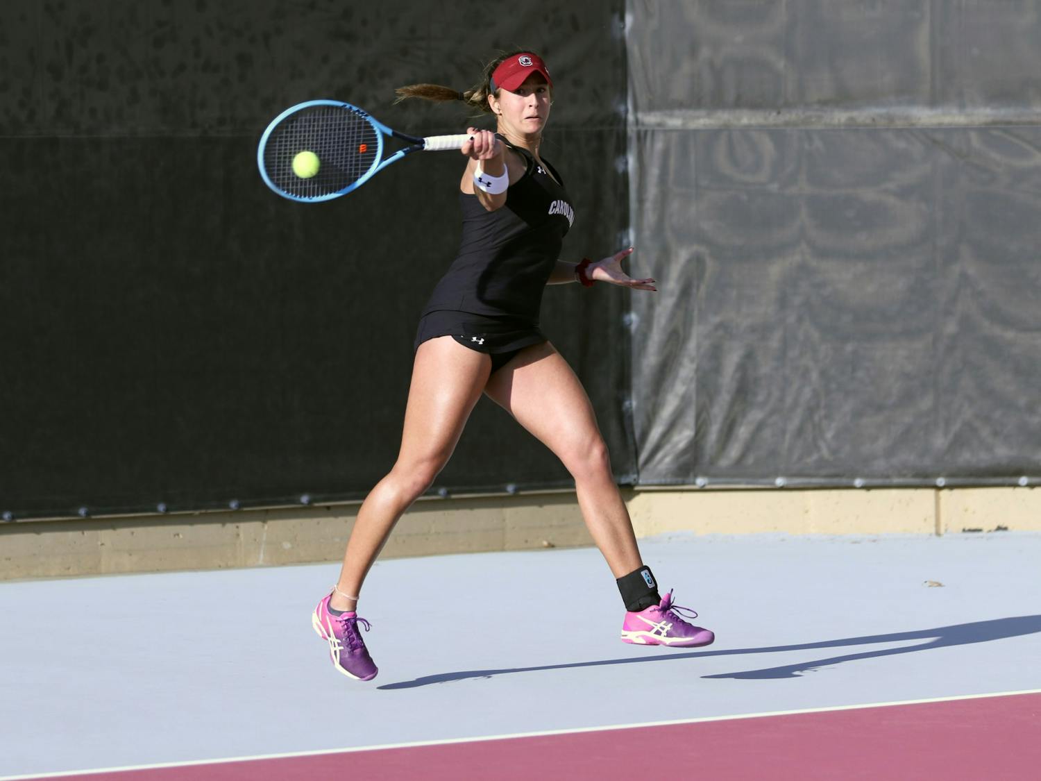 Freshman Gabriela Martinez hits a forehand during her match against Clemson on Jan. 30, 2020. Martinez came out with the win in a tiebreaker. South Carolina defeated Clemson 6-1.