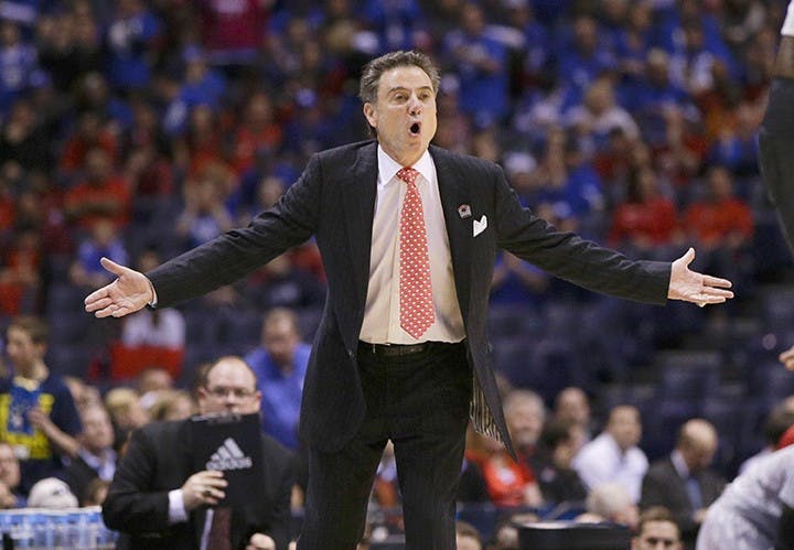 Louisville head coach Rick Pitino questions a call during action against Kentucky in the NCAA Tournament&apos;s Midwest Region semifinal at Lucas Oil Stadium in Indianapolis on Friday, March 28, 2014. (Mark Cornelison/Lexington Herald-Leader/MCT)