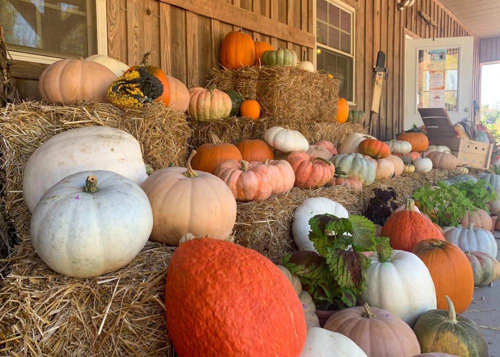 <p>A stack of various pumpkins sits outside of Heritage Fields Farm on Oct. 21, 2022. The farm was established in 1999 and provides fresh produce, flowers and seasonal crafts for the surrounding community. &nbsp;</p>
