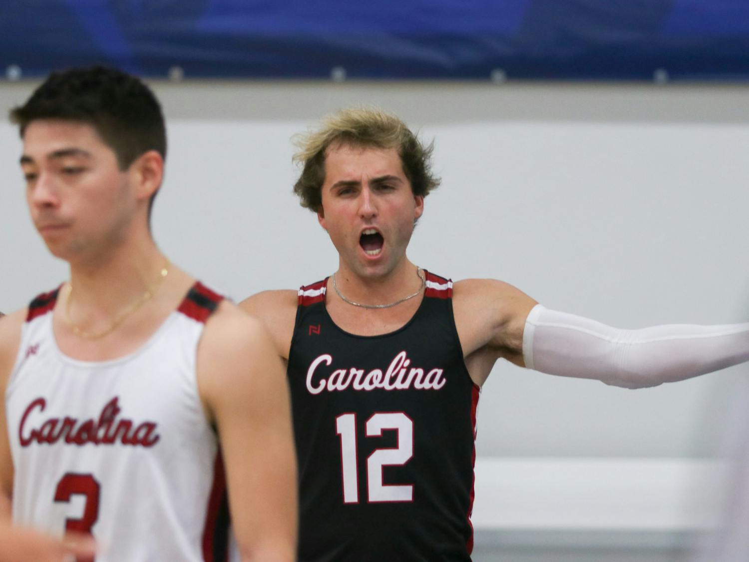 Senior libero Blake Oliver makes his way to his teammates to celebrate a point against College of Charleston A in pool play. CofC A is a regular opponent for the Gamecocks, as they played them in previous tournaments in the Fall 2022 season and past years.&nbsp;