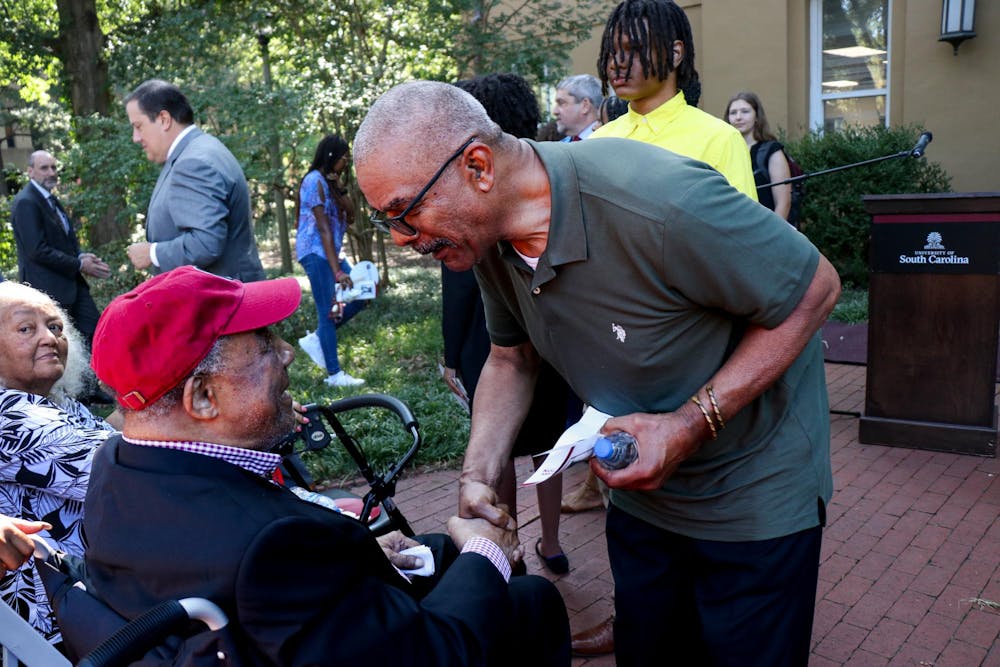 <p>FILE — James L. Solomon Jr. (left) greets attendants of the 60th Anniversary of Desegregation event at LeConte College on Sept. 11, 2023. Solomon Jr. was the first Black graduate student in mathematics at the University of South Carolina.</p>