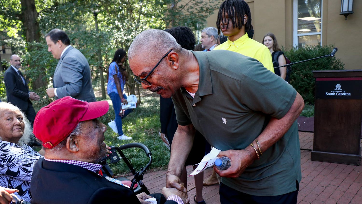 FILE — James L. Solomon Jr. (left) greets attendants of the 60th Anniversary of Desegregation event at LeConte College on Sept. 11, 2023. Solomon Jr. was the first Black graduate student in mathematics at the University of South Carolina.